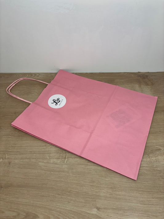 Sac de transport en papier rose pour bouquet parfumé