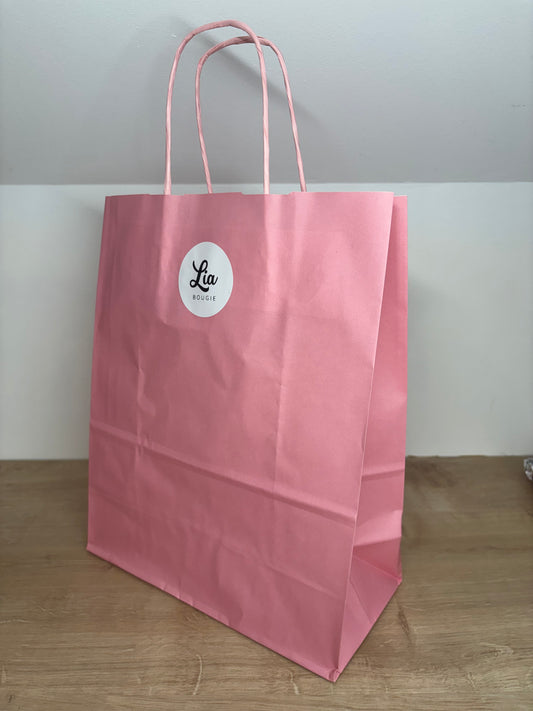Sac de transport en papier rose pour bouquet parfumé